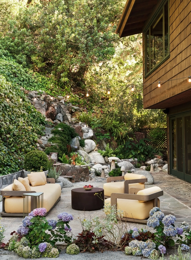 Backyard Patio with Ottoman, Chairs, and Rock Formations