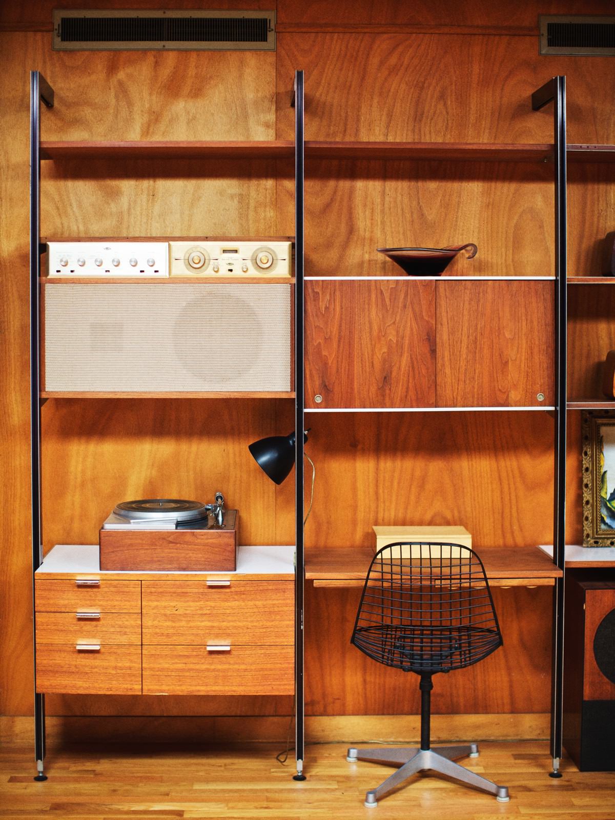 An original Nelson CSS system is outfitted with a Rek-O-Kut record player designed by the Nelson office and paired with an Eames Wire Chair-Contract Base