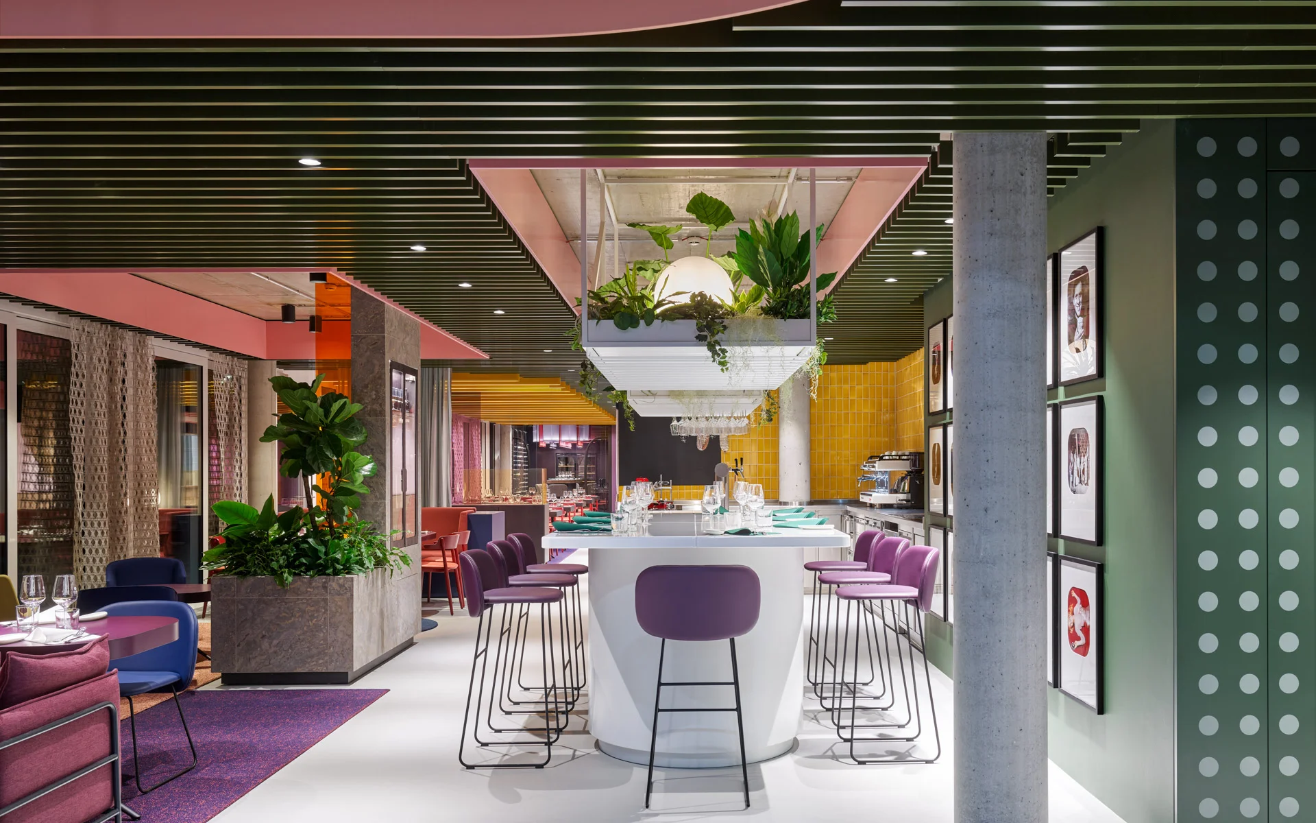 A restaurant color blocks using a wide range of colors to designate seating areas