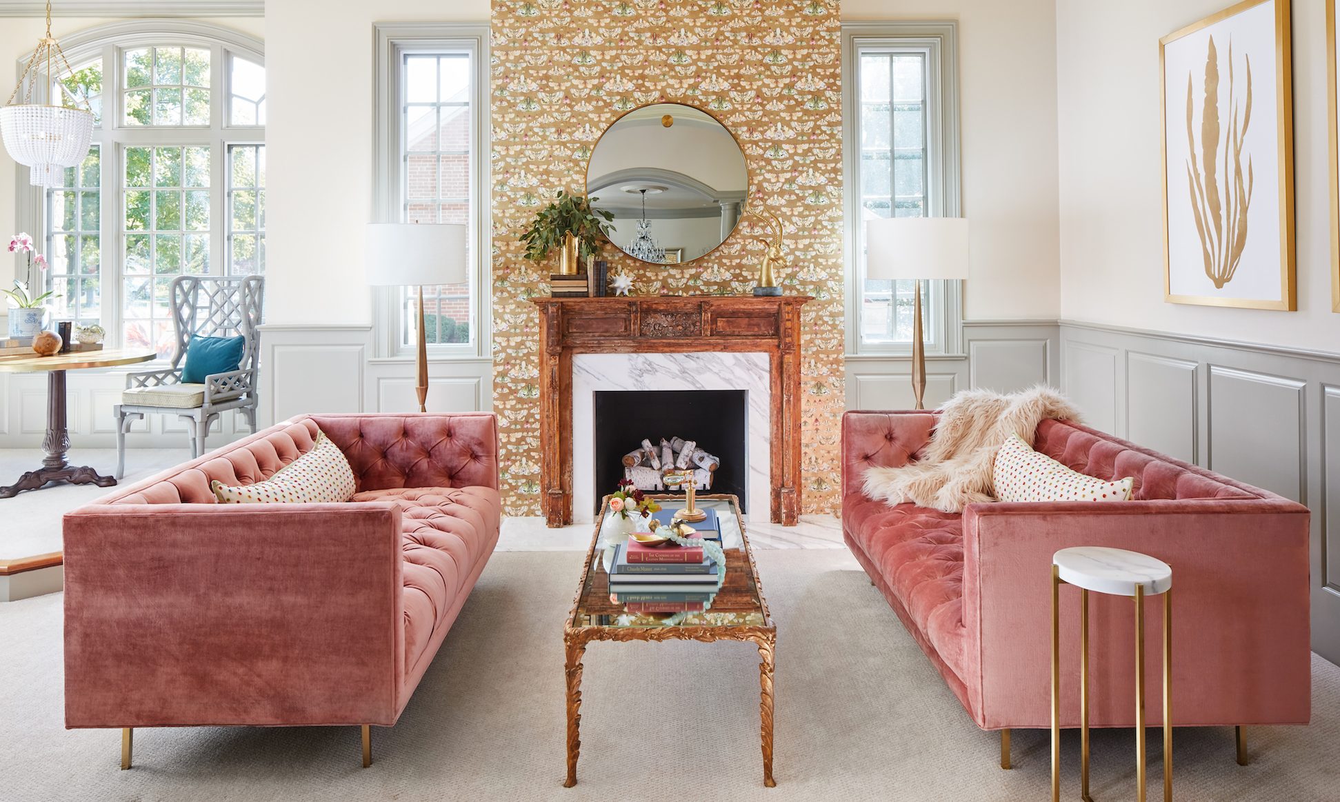 Two pink velvet sofas add texture to an otherwise minimalist living room