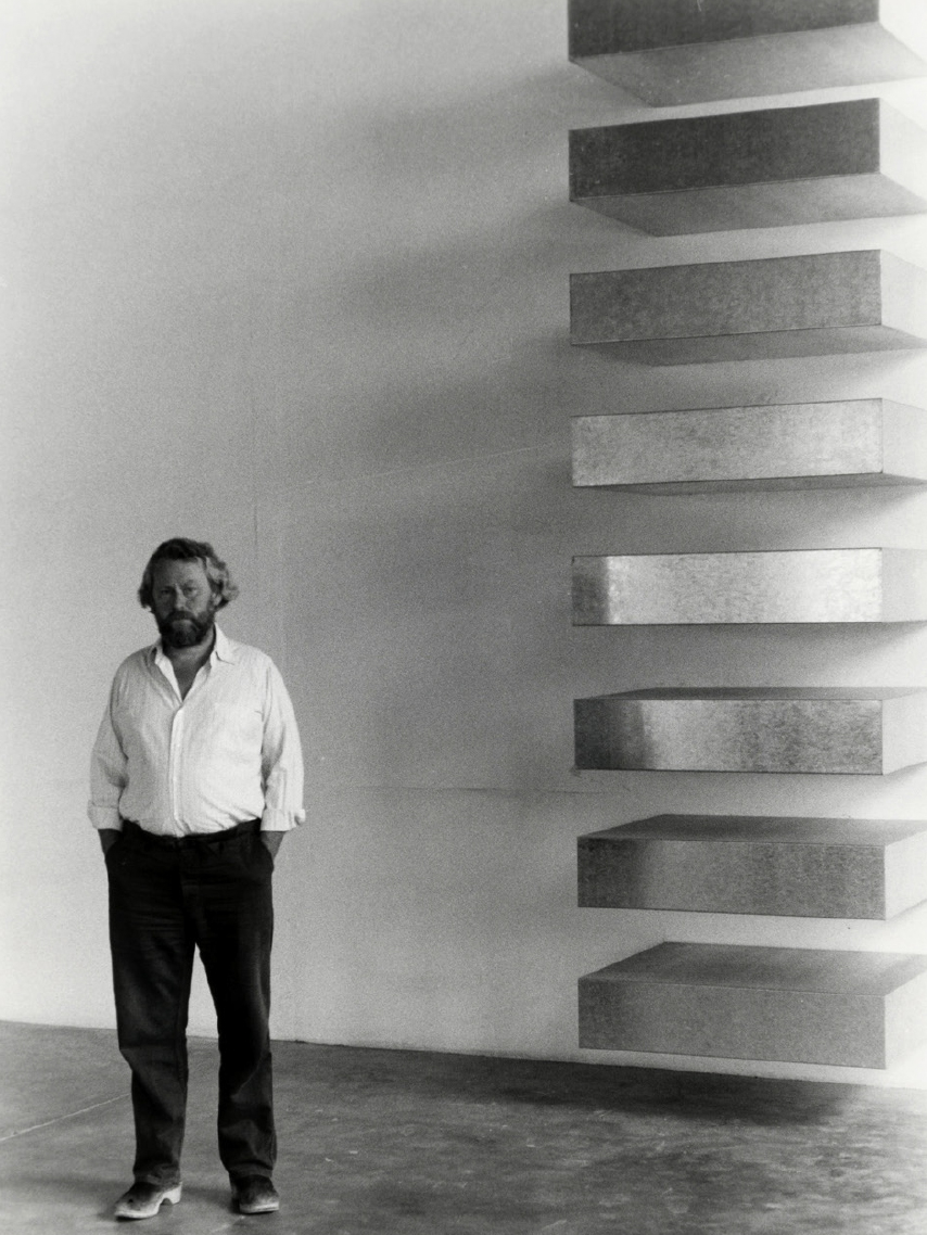 Donald Judd poses sometime in 1982 with one of his signature 'Untitled' works